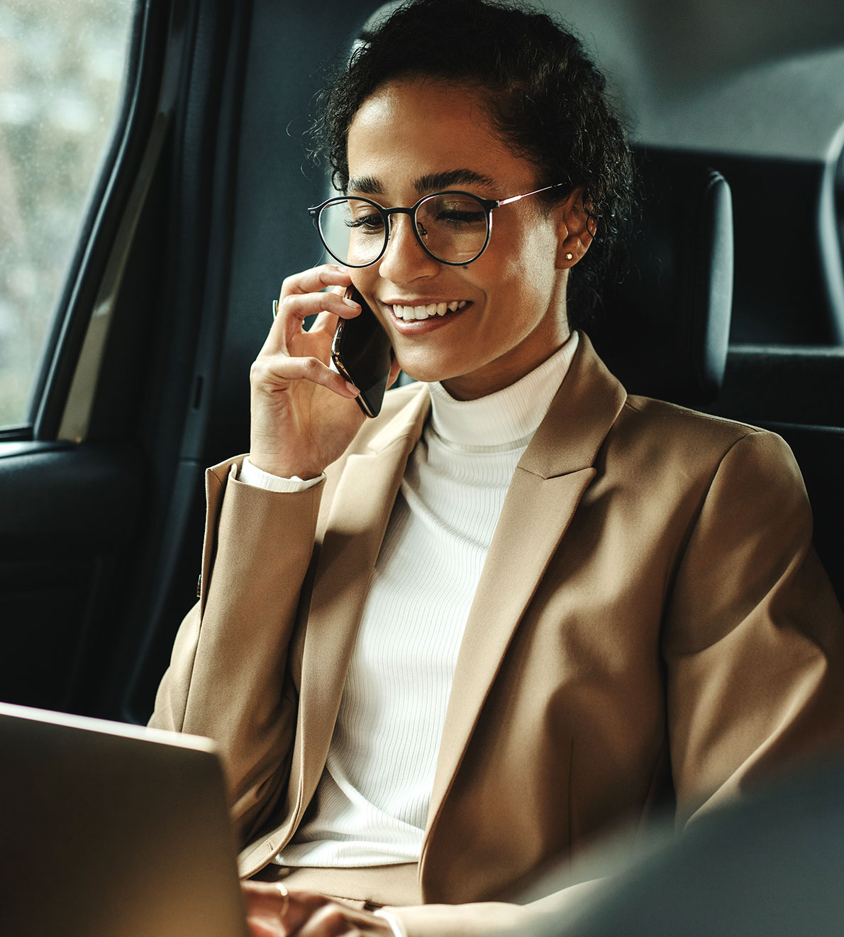Woman in car speaking on phone